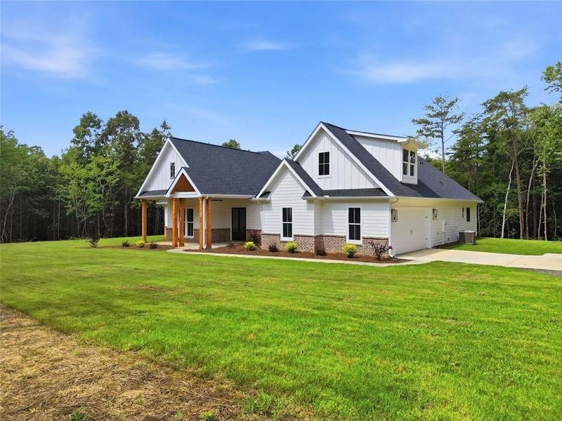 Front exterior of a new home in , White, GA, highlighting curb appeal (Image 2). Front exterior of a new home in , White, GA, highlighting curb appeal (Image 2).