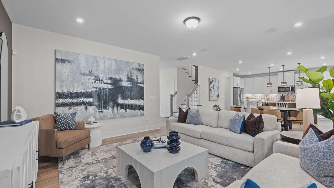 Open concept family room and kitchen in the Jordan Design by DRB Homes in York, SC