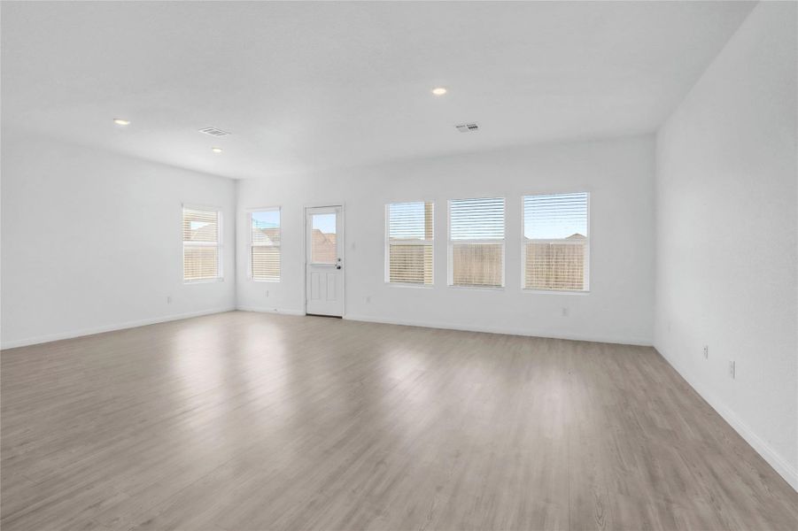 Unfurnished living room featuring light wood-style floors and recessed lighting