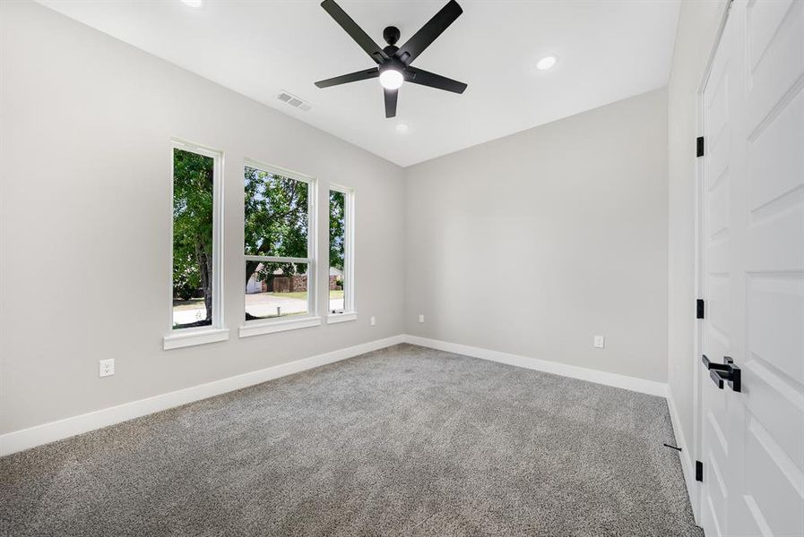 Front 3rd Bedroom with a ceiling fan, carpet floors, and recessed lighting Front 3rd Bedroom with a ceiling fan, carpet floors, and recessed lighting