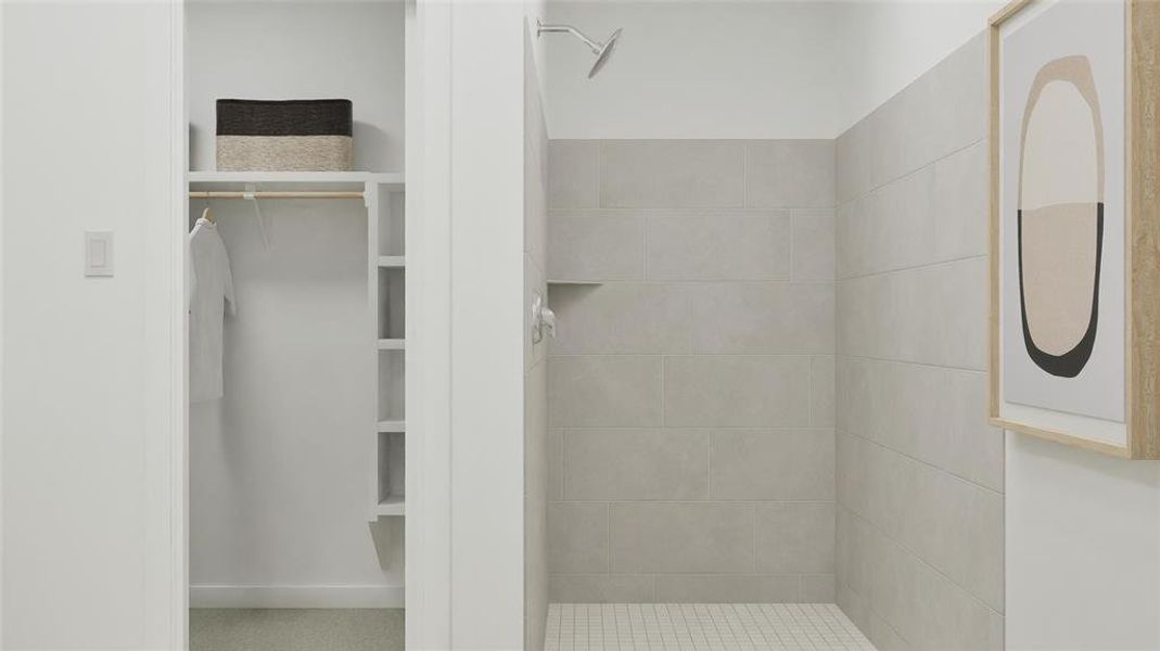 Bathroom featuring a stall shower and a walk in closet Bathroom featuring a stall shower and a walk in closet