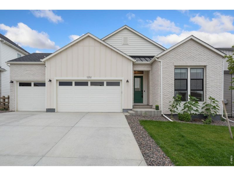 Front exterior of a new home in , Timnath, CO, highlighting curb appeal (Image 24). Front exterior of a new home in , Timnath, CO, highlighting curb appeal (Image 24).