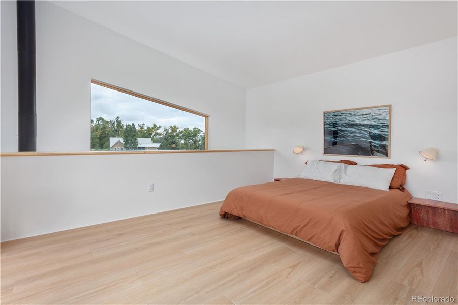 Primary bedroom in lofted upstairs of Unit 2.