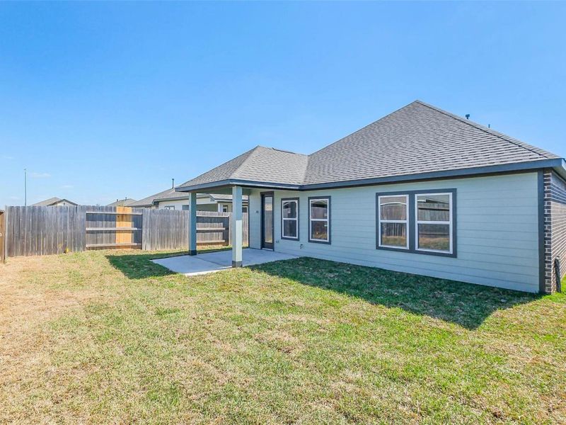 Exterior details and patio area of a home in Sunterra, Katy (Image 24).