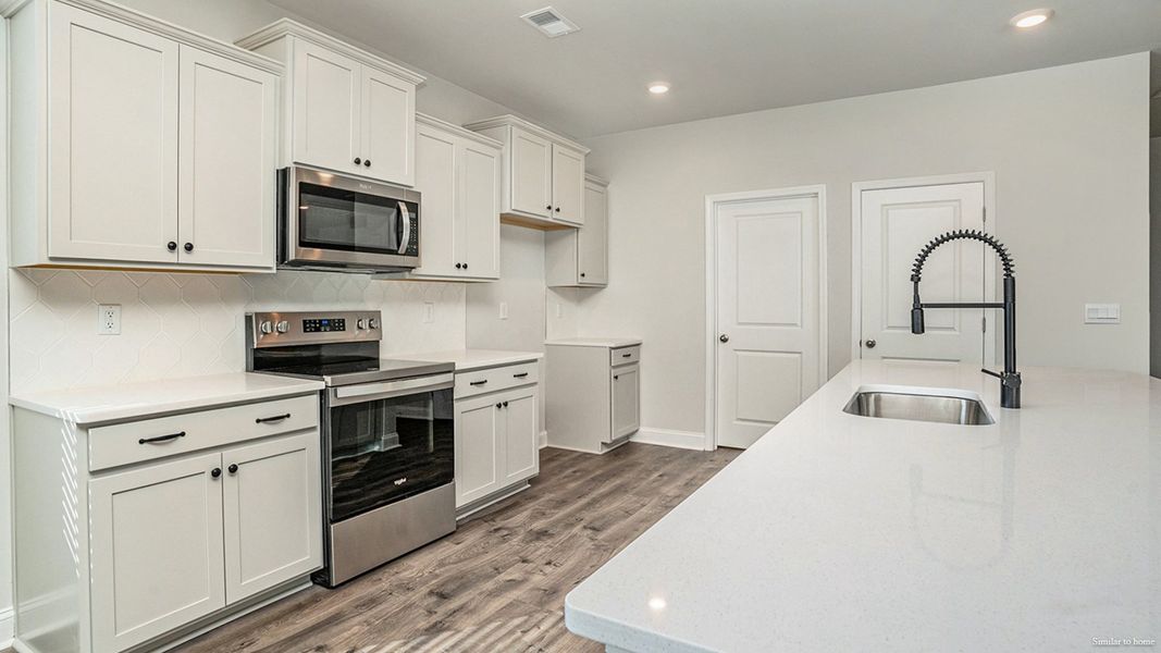Representative furnished interior of a home built from the Delmont by D.R. Horton in Merchant Point, Jacksonville (Image 9).