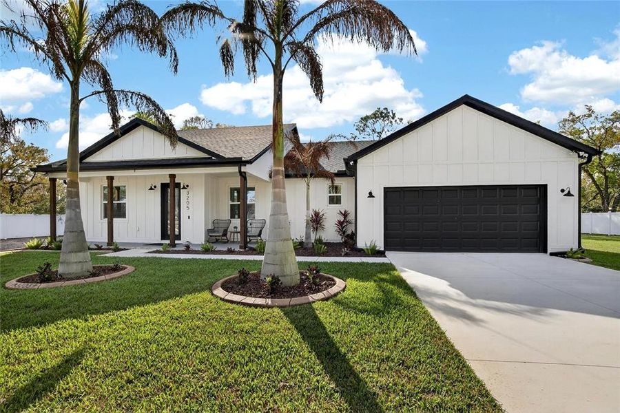 Front exterior of a new home in , Plant City, FL, highlighting curb appeal (Image 21).