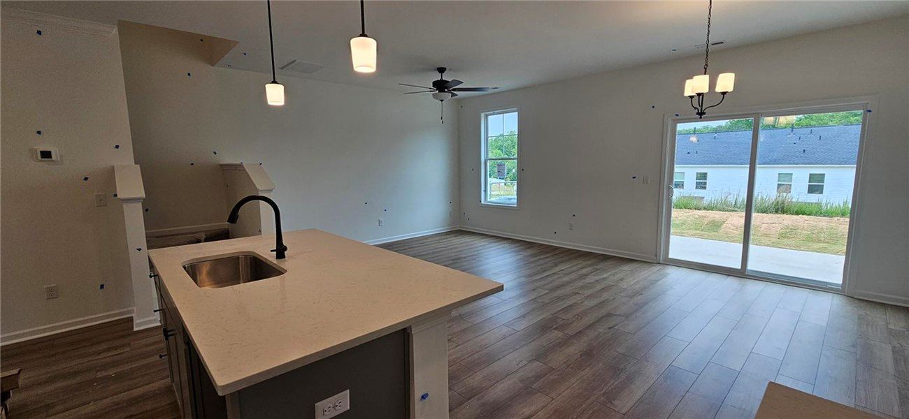This bright, open-concept living space features st