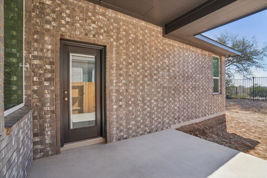 Exterior details and patio area of a home in Meyer Ranch, New Braunfels (Image 24).