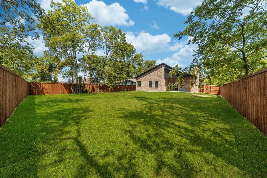View of fenced backyard