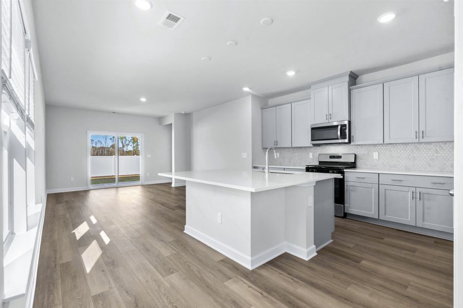 Furnished interior view inside a new home in Cypress Ridge - The Boardwalk Series, Longs (Image 3).