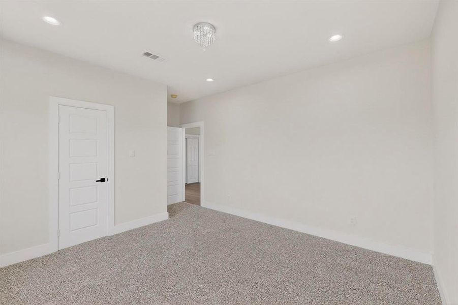 Bedroom featuring carpet flooring and recessed lighting Bedroom featuring carpet flooring and recessed lighting