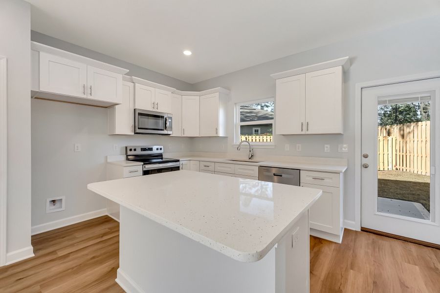 Furnished interior view inside a new home in Live Oak Cottages, Freeport (Image 6).
