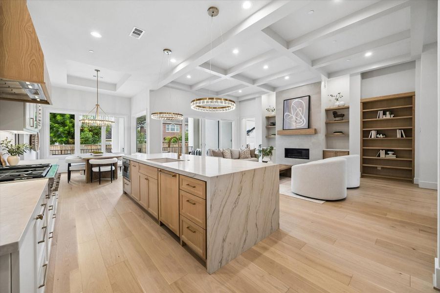 From this angle, the kitchen opens toward the casual dining area and covered patio, with sliding doors creating an easy connection for indoor-outdoor entertaining. From this angle, the kitchen opens toward the casual dining area and covered patio, with sliding doors creating an easy connection for indoor-outdoor entertaining.