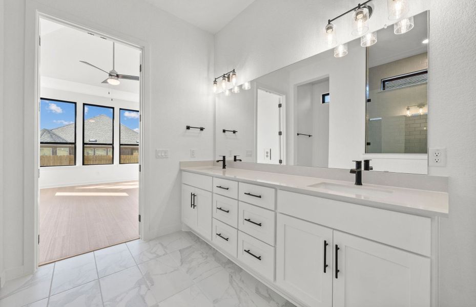 Furnished interior view inside a new home in 6 Creeks, Kyle (Image 9).