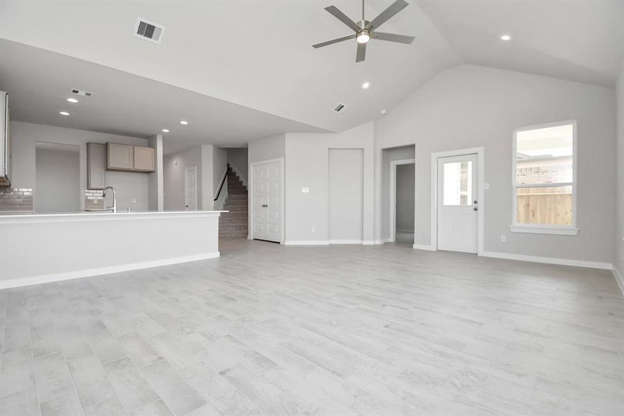 Another view of the expansive family room. Sample photo of completed home with similar floor plan. Actual colors and selections may vary.