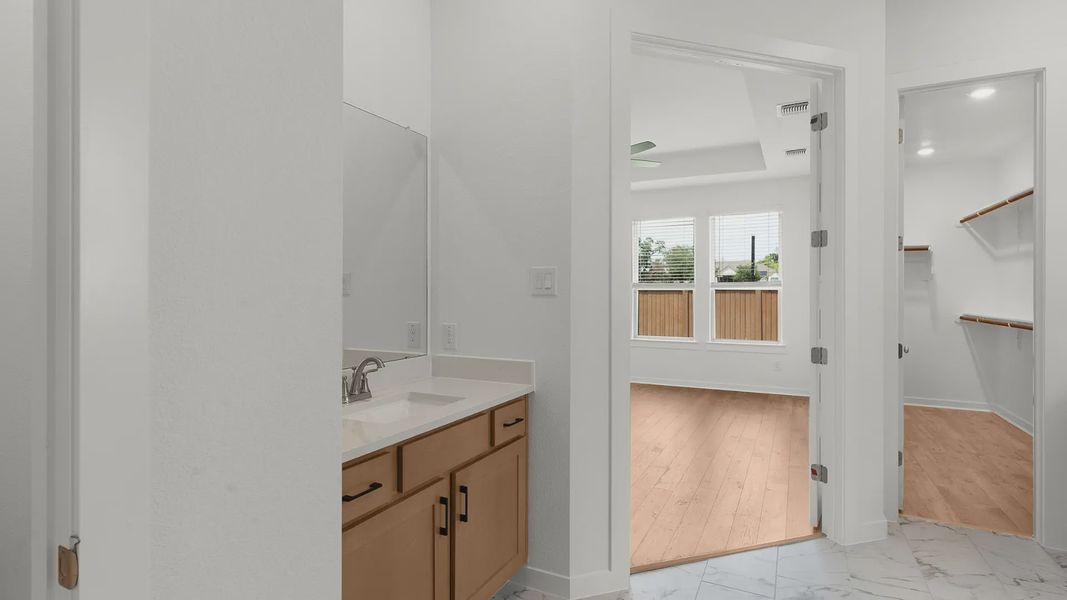 Representative furnished interior of a home built from the Bryson by Chesmar Homes in Newhaven, Manor (Image 8).