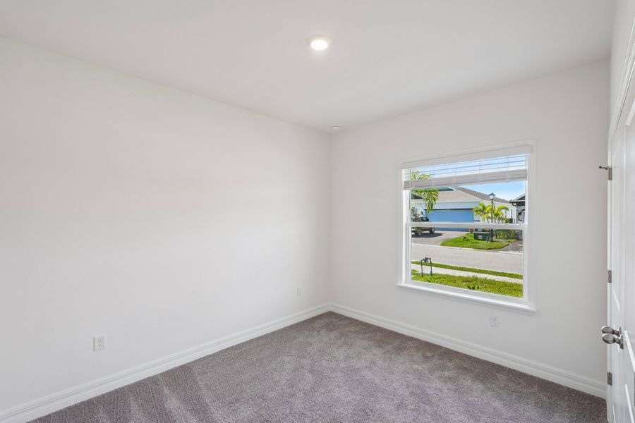 Spacious, unfurnished interior of a new home in Heritage Station, Punta Gorda (Image 51).
