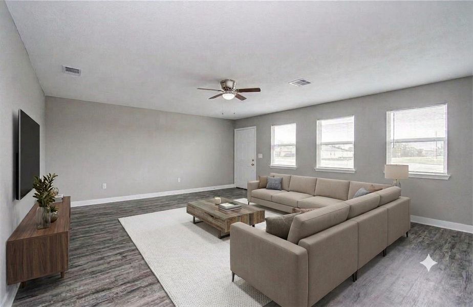 Open-concept living and kitchen area. (Virtually Staged)