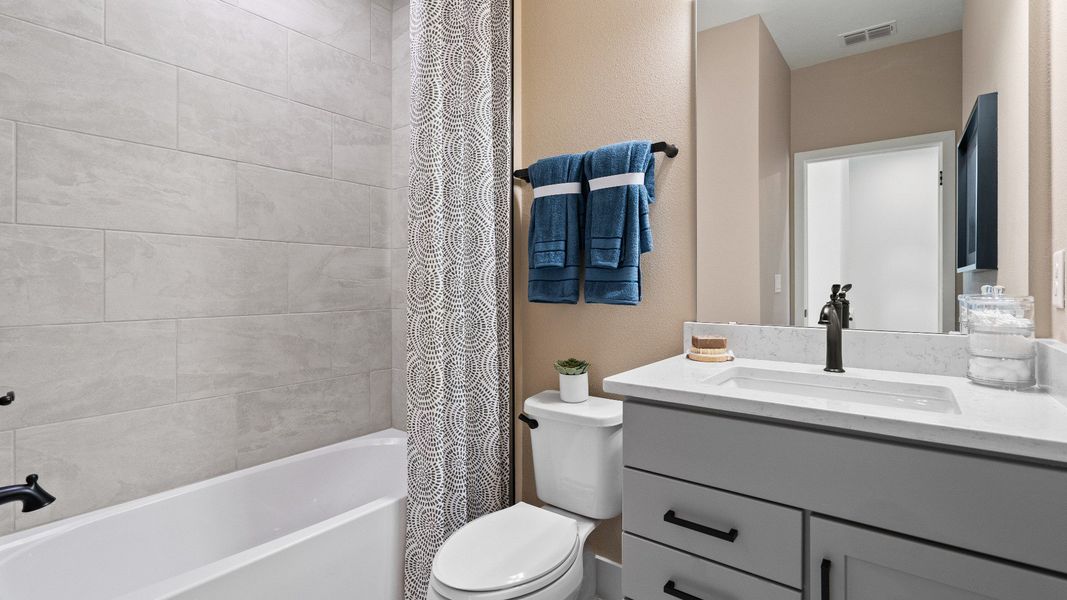 Representative furnished interior of a home built from the Lantana End Unit by DRB Homes in Parkview at Hamlin, Winter Garden (Image 39).