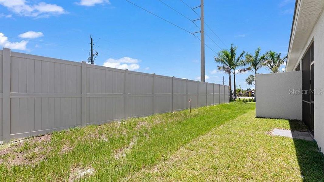 Exterior details and patio area of a home in Palm Lake at Coco Bay, Englewood (Image 20).
