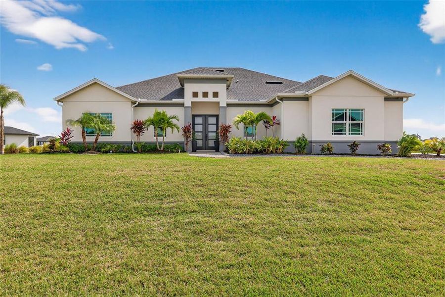Front exterior of a new home in , Cape Coral, FL, highlighting curb appeal (Image 26).