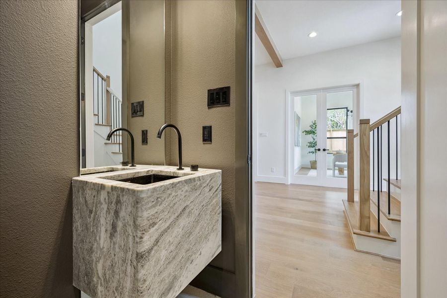 Full bath on the first floor - offers a floating vanity and a walk-in shower. Full bath on the first floor - offers a floating vanity and a walk-in shower.
