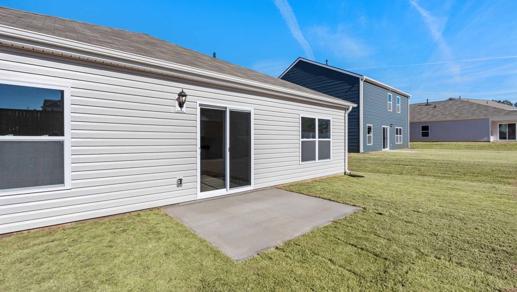 Exterior details and patio area of a home in Lightwood Cottages, Moore (Image 3).