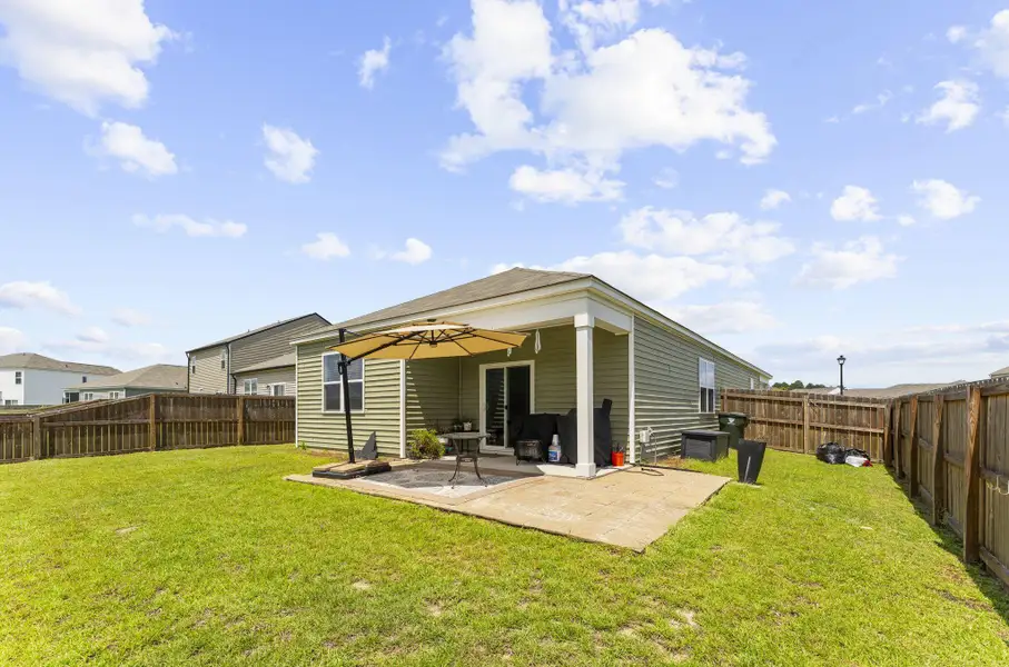 Exterior details and patio area of a home in Pine Hills at Cane Bay, Summerville (Image 3).