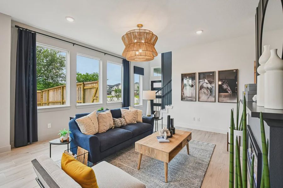 Furnished interior view inside a new home in Meridiana Chateau, Manvel (Image 19).