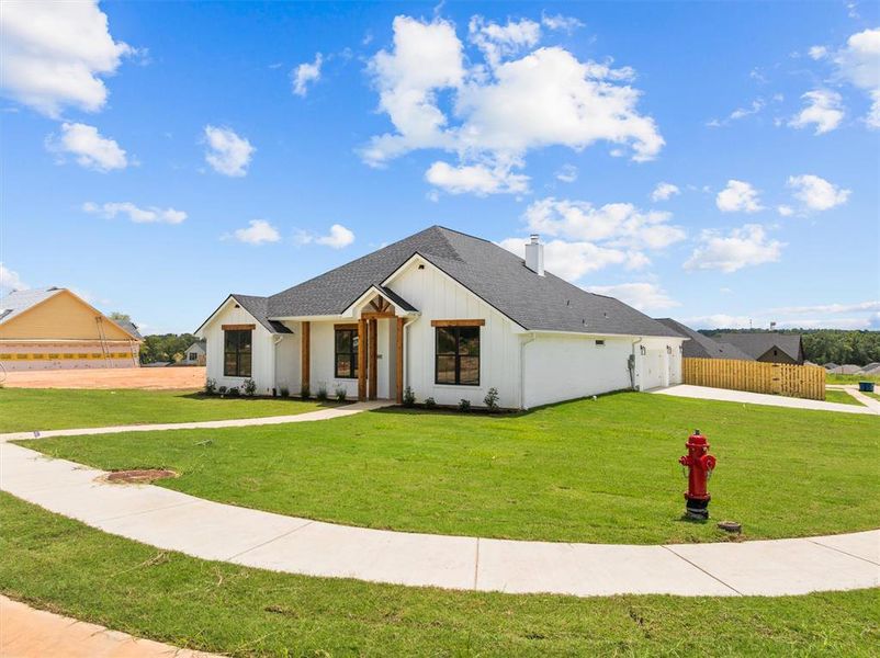 Front exterior of a new home in , Lindale, TX, highlighting curb appeal (Image 2).