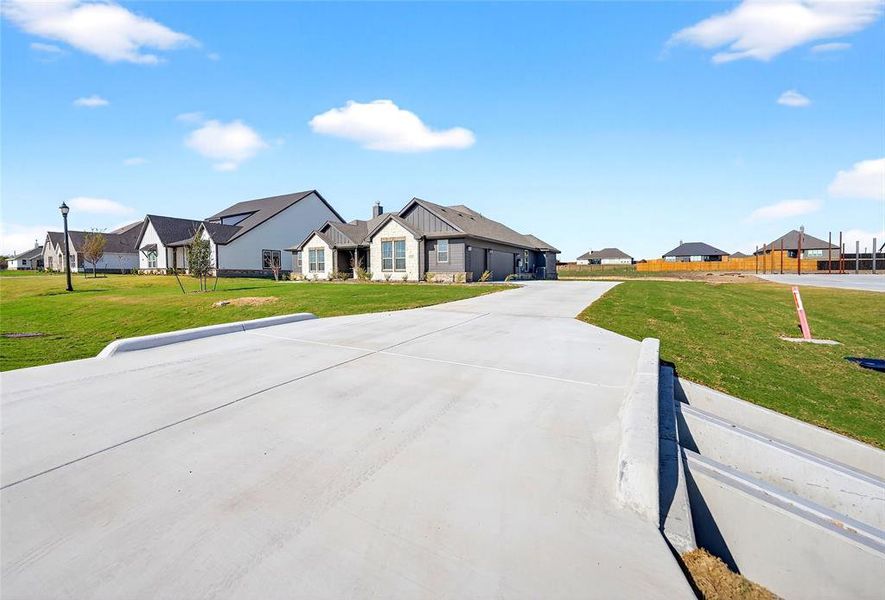 Front exterior of a new home in Fairview Meadows, New Fairview, TX, highlighting curb appeal (Image 2). Front exterior of a new home in Fairview Meadows, New Fairview, TX, highlighting curb appeal (Image 2).