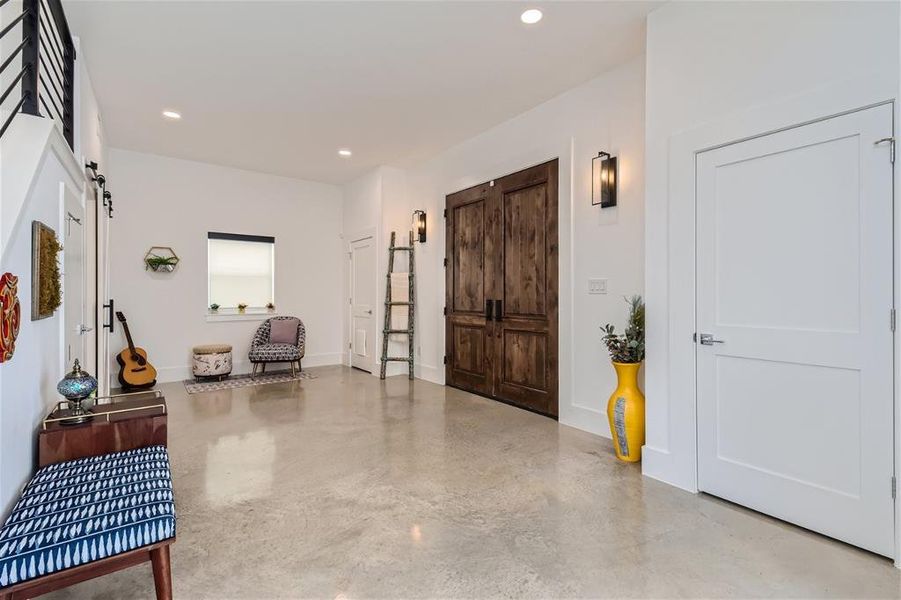 Spacious Foyer with closets, storage and powder room.