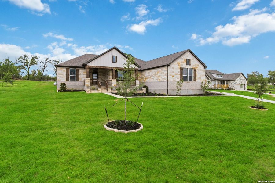 Front exterior of a new home in Jordan's Ranch, San Antonio, TX, highlighting curb appeal (Image 22).