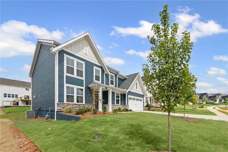 Front exterior of a new home in Twin Lakes, Hoschton, GA, highlighting curb appeal (Image 23).