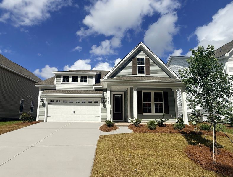 Front exterior of a new home in Arcadia, Myrtle Beach, SC, highlighting curb appeal (Image 1). Front exterior of a new home in Arcadia, Myrtle Beach, SC, highlighting curb appeal (Image 1).