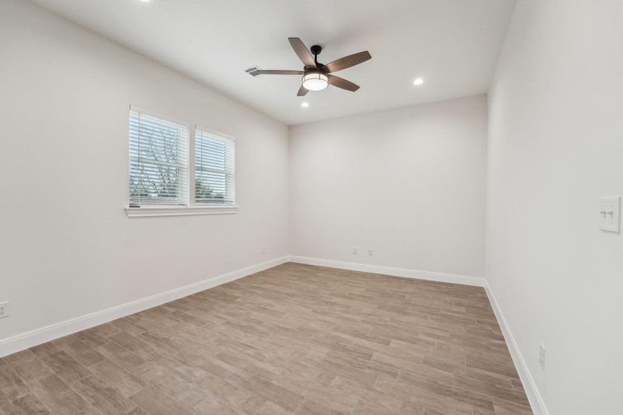 Unfurnished room featuring recessed lighting, light wood-style flooring, baseboards, and ceiling fan Unfurnished room featuring recessed lighting, light wood-style flooring, baseboards, and ceiling fan