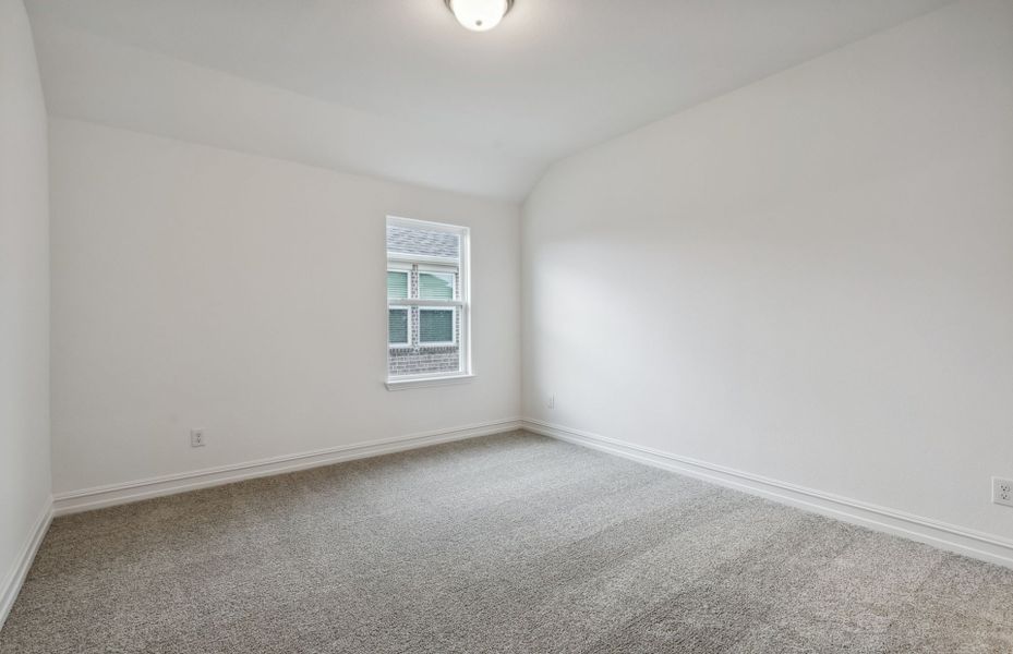 Spacious secondary bedroom with ample closet space *real home pictured