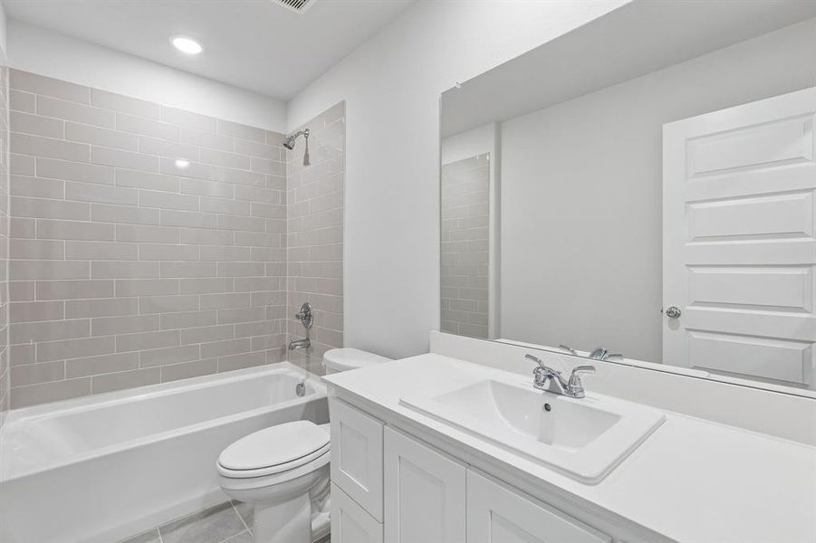 Bathroom in the Harrison home plan by Trophy Signature Homes – REPRESENTATIVE PHOTO