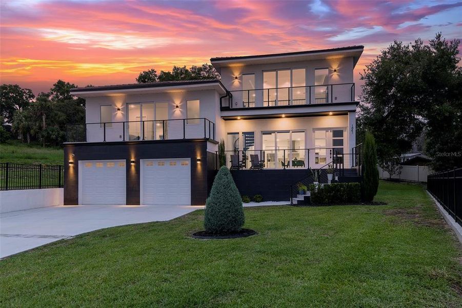 Front exterior of a new home in , Clermont, FL, highlighting curb appeal (Image 1). Front exterior of a new home in , Clermont, FL, highlighting curb appeal (Image 1).
