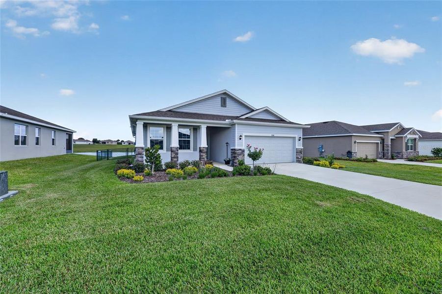 Front exterior of a new home in JB Ranch, Ocala, FL, highlighting curb appeal (Image 20).