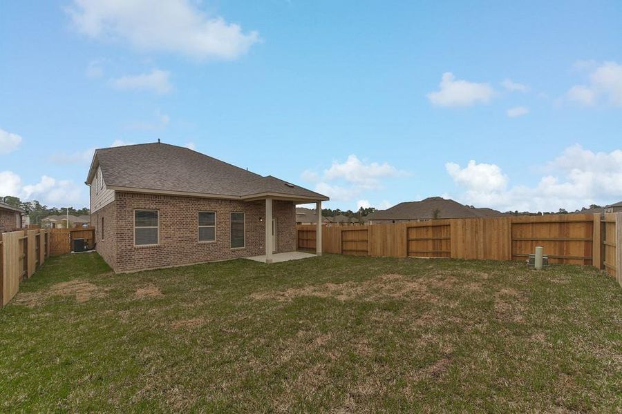 Exterior details and patio area of a home in Montgomery Ridge: Landmark Collection, Montgomery (Image 3).