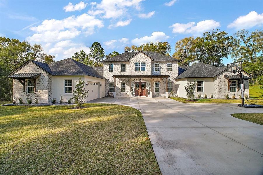 Front exterior of a new home in , Deland, FL, highlighting curb appeal (Image 2).