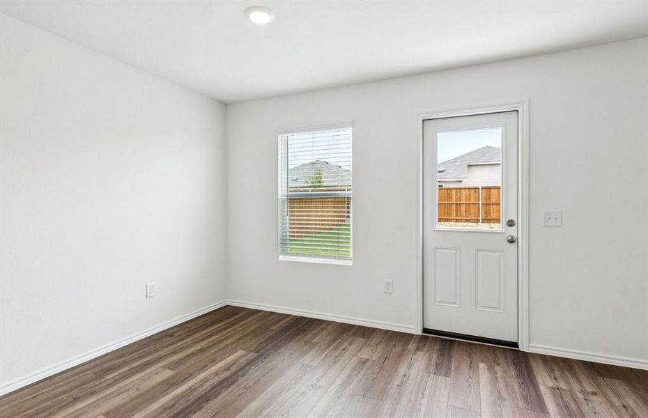 Dining nook off kitchen with large windows Dining nook off kitchen with large windows