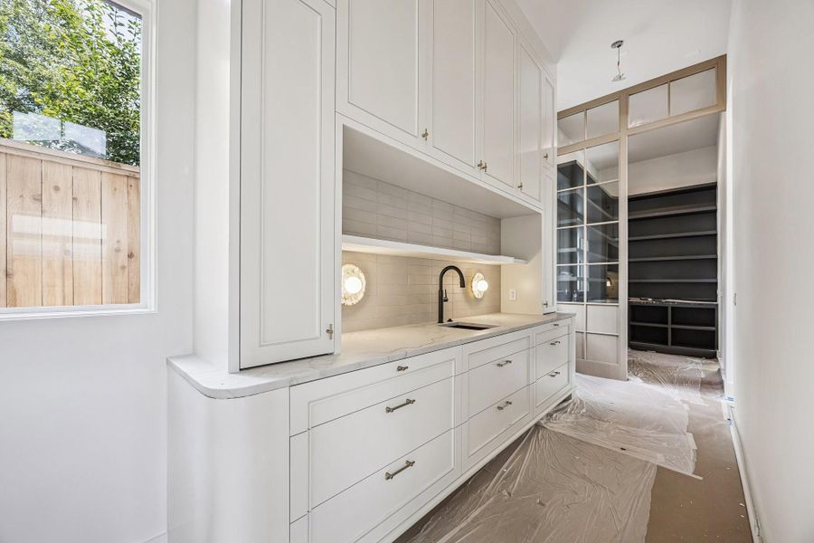 Incredible Scullery with Inset Cabinetry, Slab Quarzite Counter, Tile Backsplash, Undermount Sink, Sconce Lighting and more ......     Construction as of June 1st, 2026.