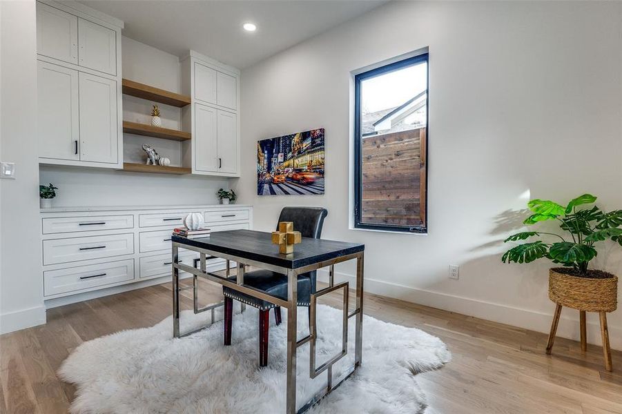 Home office featuring light hardwood / wood-style flooring