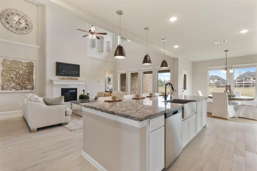 Stunning kitchen open to the great room (*Photo not of actual home and used for illustration purposes only.)