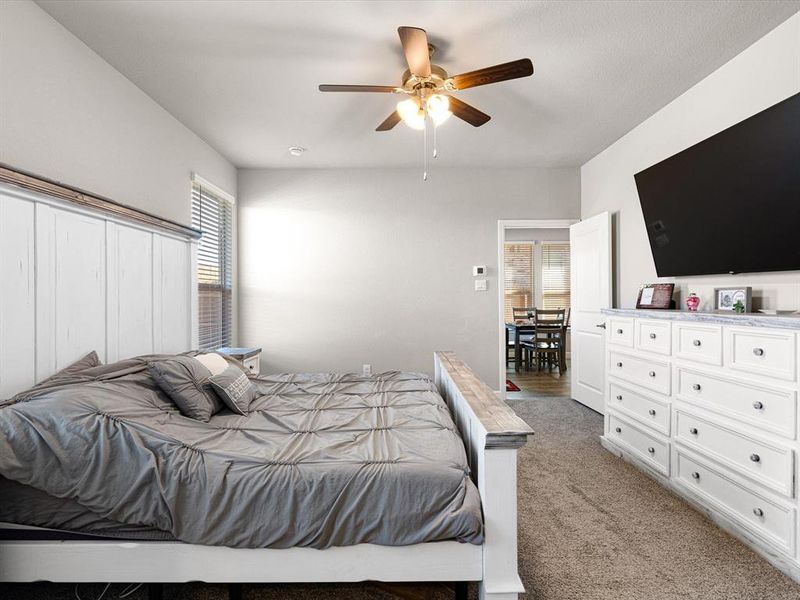 Bedroom featuring ceiling fan and light carpet