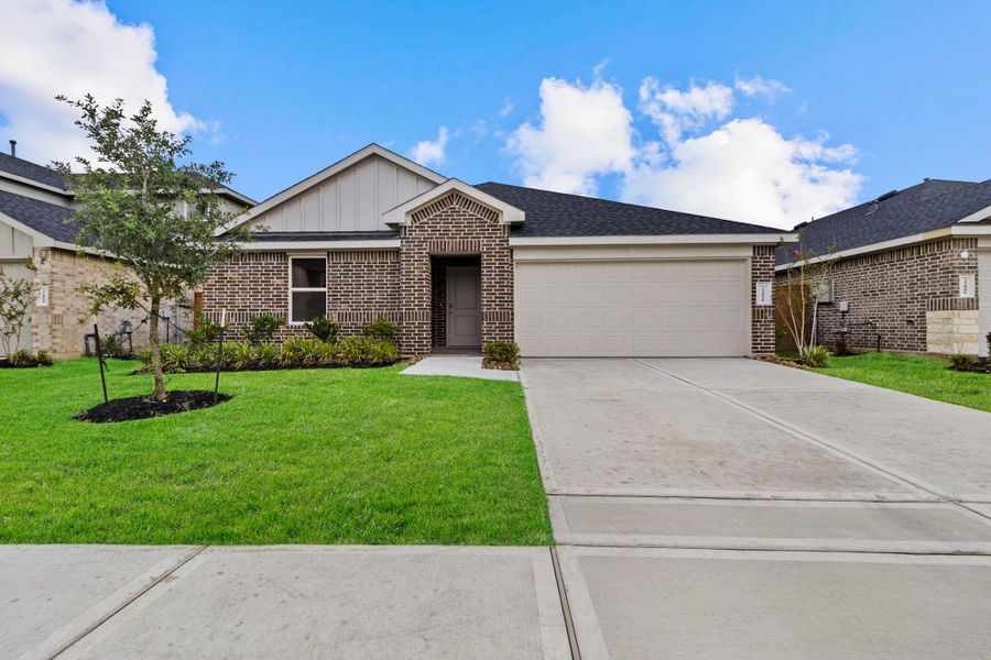 Front exterior of a new home in Cypress Green, Hockley, TX, highlighting curb appeal (Image 2). Front exterior of a new home in Cypress Green, Hockley, TX, highlighting curb appeal (Image 2).