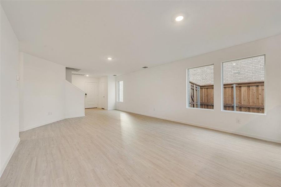 Unfurnished room with light hardwood / wood-style floors