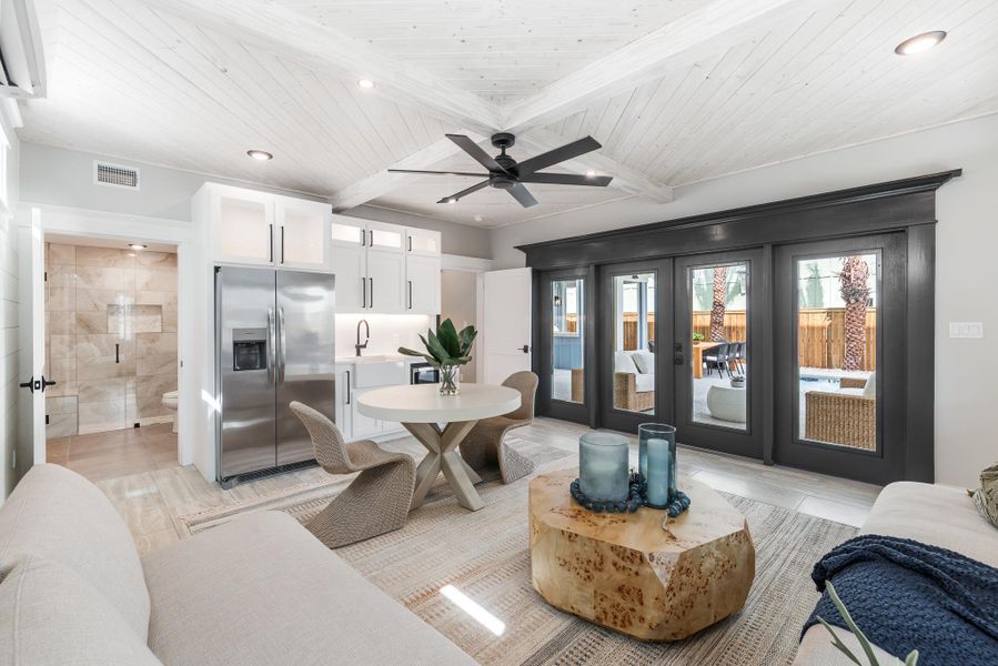 Living area with french doors, recessed lighting, beamed ceiling, a ceiling fan, and coffered ceiling Living area with french doors, recessed lighting, beamed ceiling, a ceiling fan, and coffered ceiling